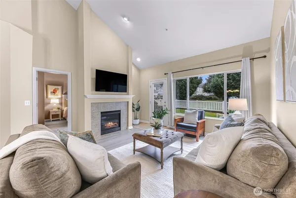 a living room with furniture fireplace and a flat screen tv