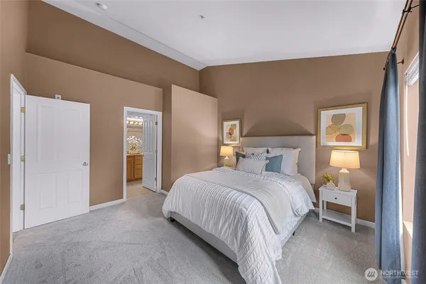 a bedroom with a bed and a lamp
