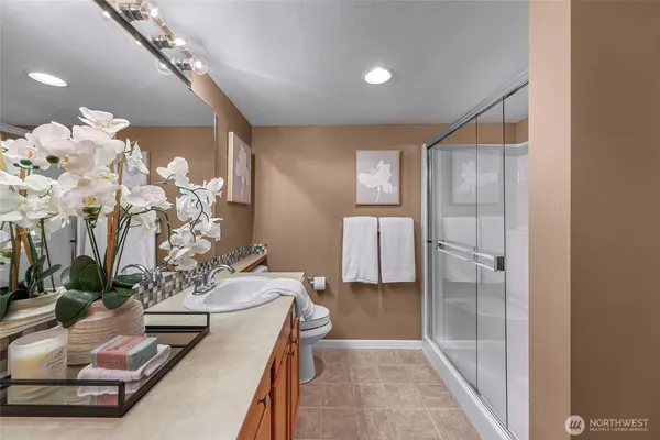 a dining room with furniture and a chandelier