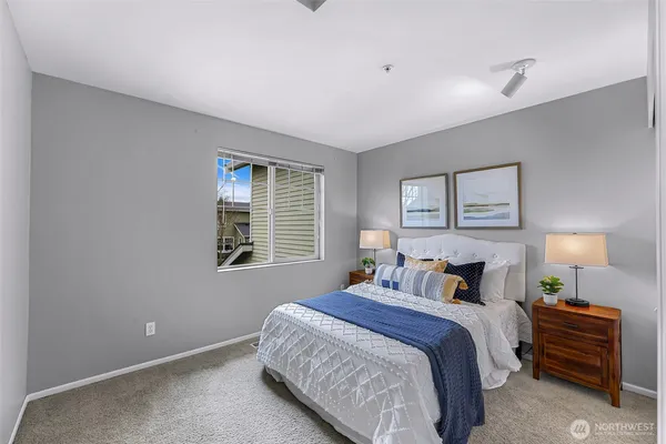 a bedroom with bed and window