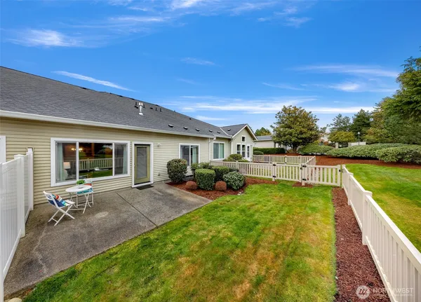 a view of a house with backyard porch and garden