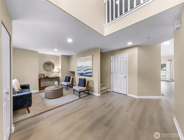 a living room with furniture window and a table