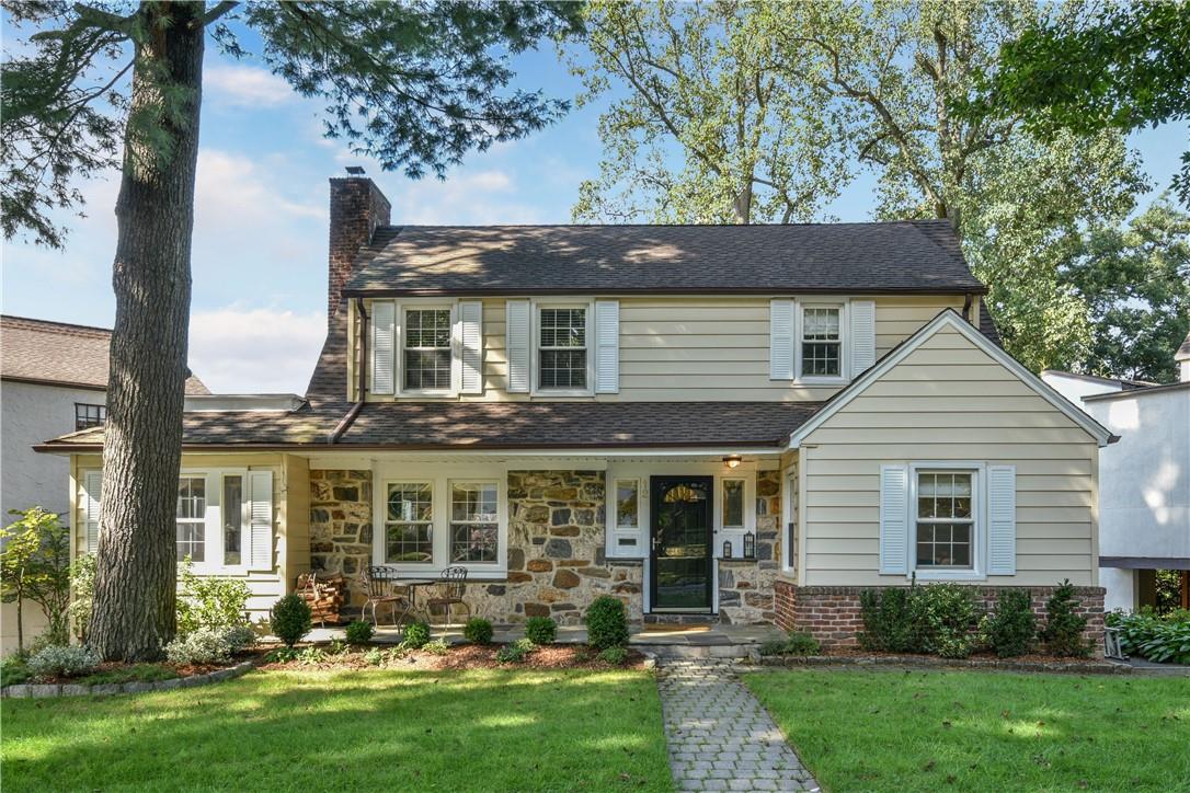 front view of a house with a yard