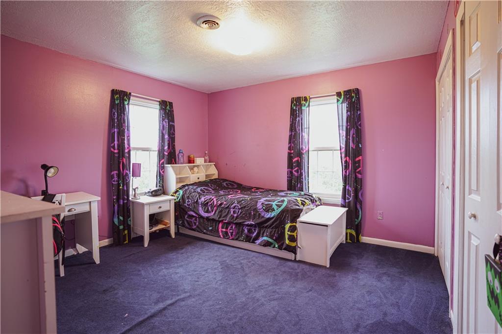 105 Tate Road Hookstown, PA 15050 - Photo 14 of 25 a bedroom with a bed and a desk