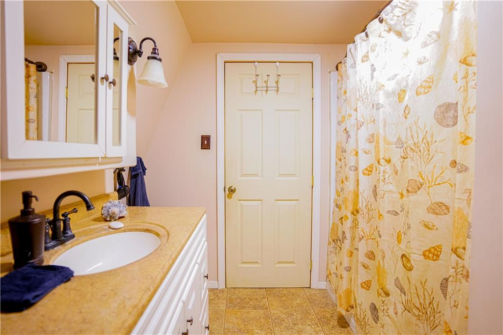 105 Tate Road Hookstown, PA 15050 - Photo 16 of 25 a bathroom with a sink and a mirror