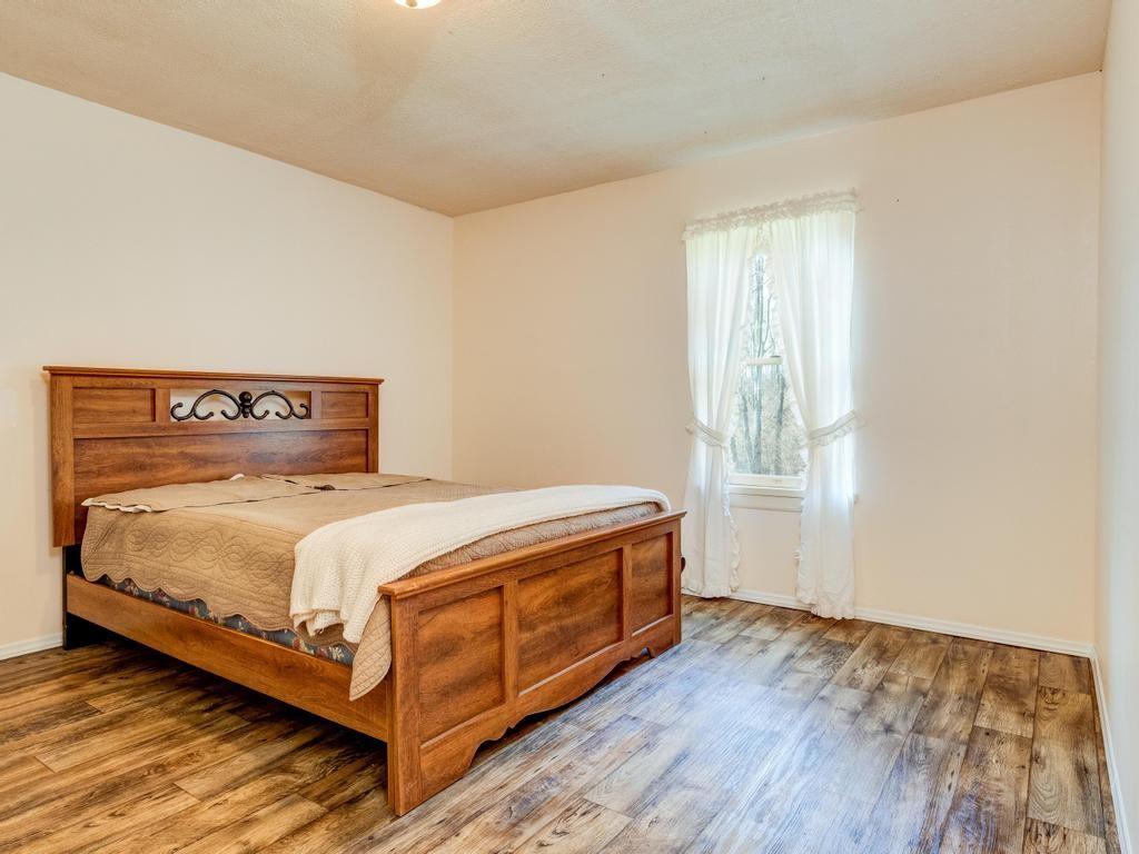 105 Tate Road Hookstown, PA 15050 - Photo 18 of 25 a bed sitting in a bedroom next to a window