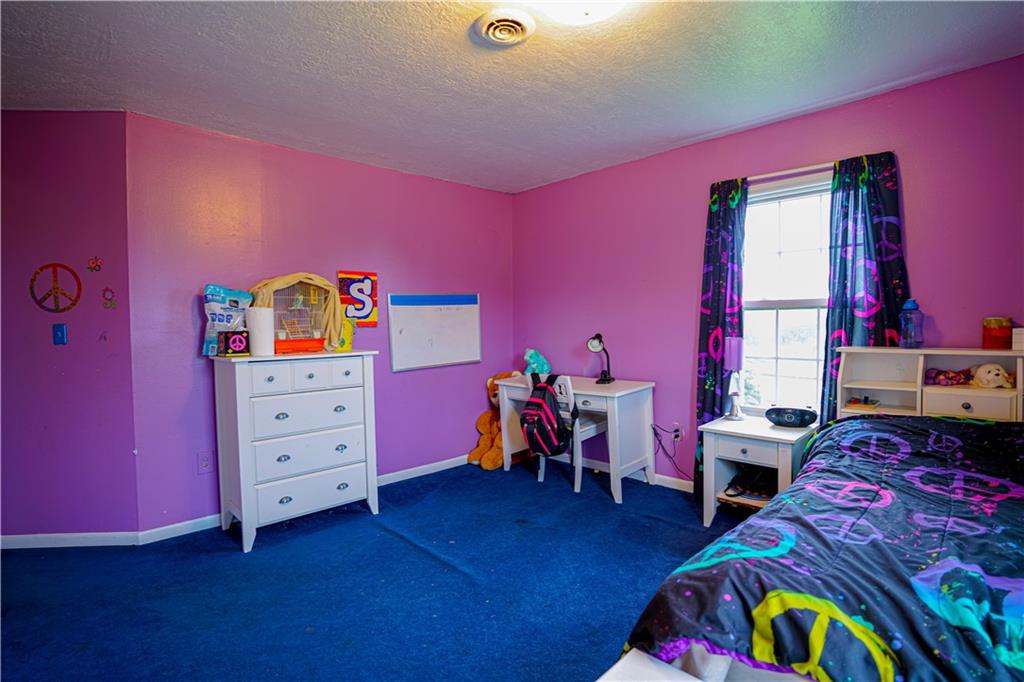 105 Tate Road Hookstown, PA 15050 - Photo 24 of 25 a bedroom with furniture and a baby crib