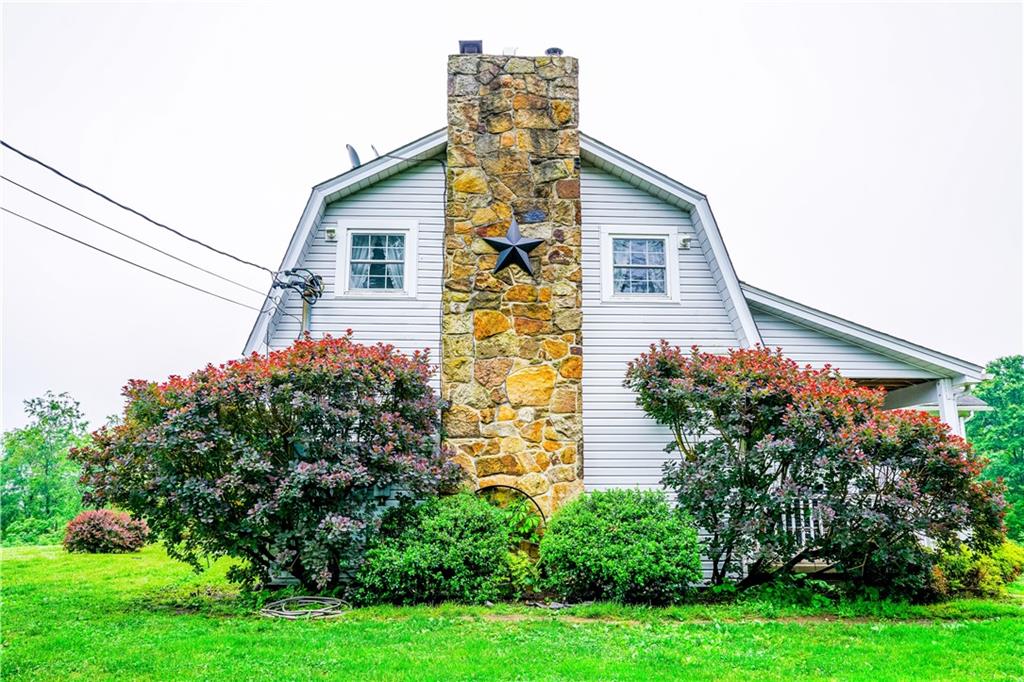 105 Tate Road Hookstown, PA 15050 - Photo 25 of 25 a house that has a lot of plants in it