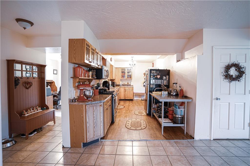 105 Tate Road Hookstown, PA 15050 - Photo 4 of 25 a kitchen with stainless steel appliances granite countertop a stove and a refrigerator