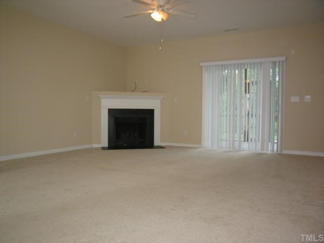 5948 Osprey Cove Drive Raleigh, NC 27604 - Photo 3 of 12 a view of an empty room with a fireplace