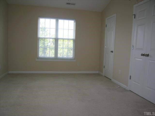 5948 Osprey Cove Drive Raleigh, NC 27604 - Photo 6 of 12 an empty room with a window