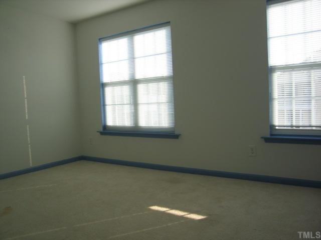 5948 Osprey Cove Drive Raleigh, NC 27604 - Photo 9 of 12 an empty room with a window
