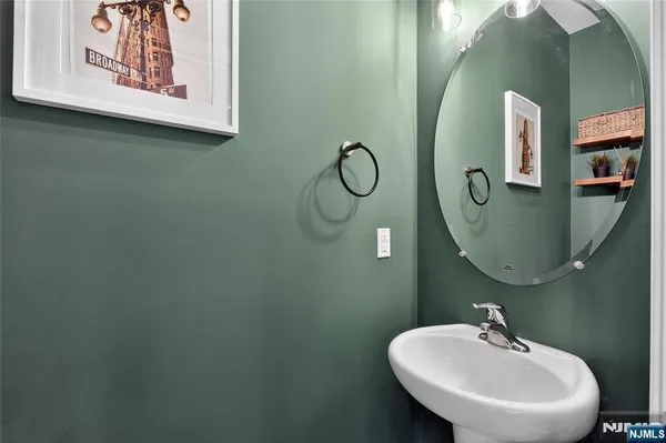 a bathroom with a sink and mirror