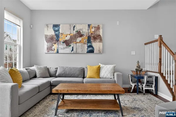 a living room with furniture and a rug