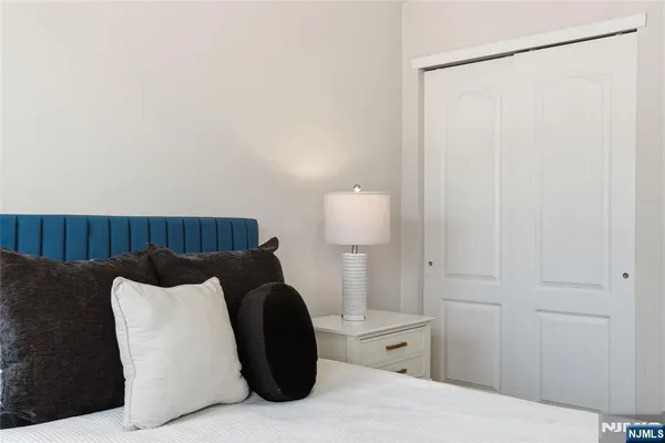 a bedroom with a bed and a couch