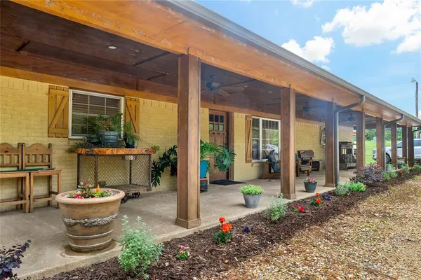 a front view of a house with outdoor seating