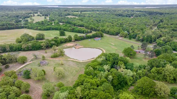 an aerial view of a house with outdoor space