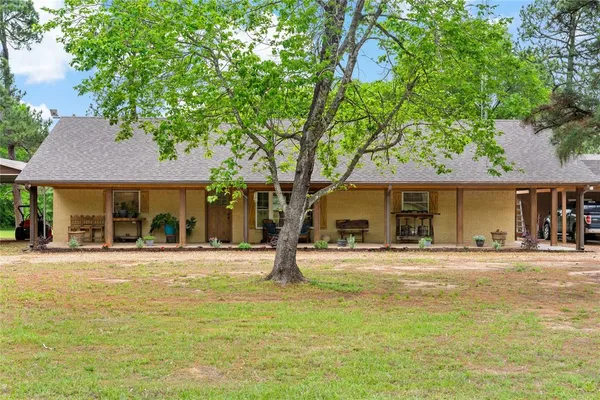 a house with trees in the background