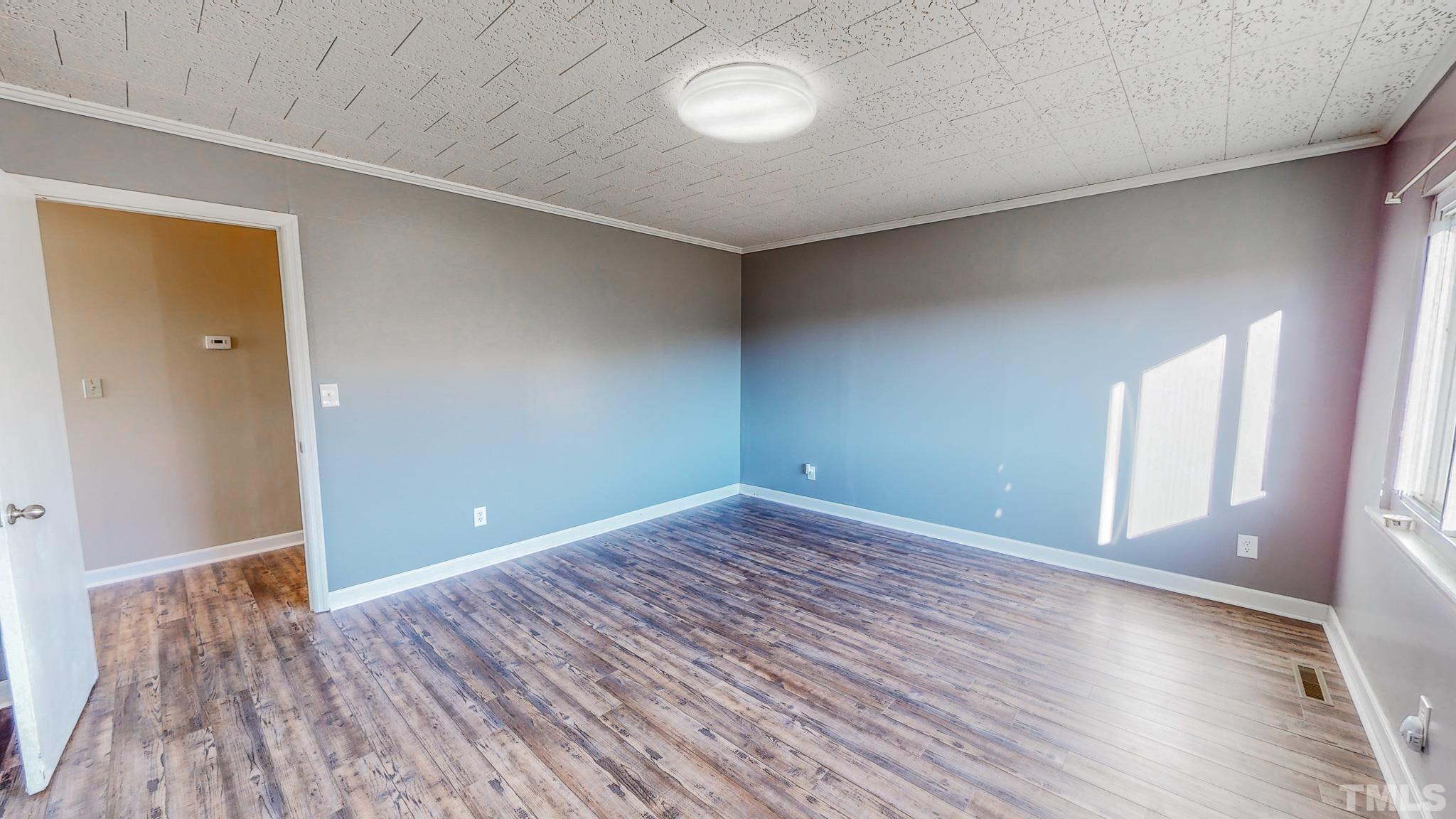 3772 Mt Harmony Church Road Rougemont, NC 27572 - Photo 20 of 66 wooden floor in an empty room with a window