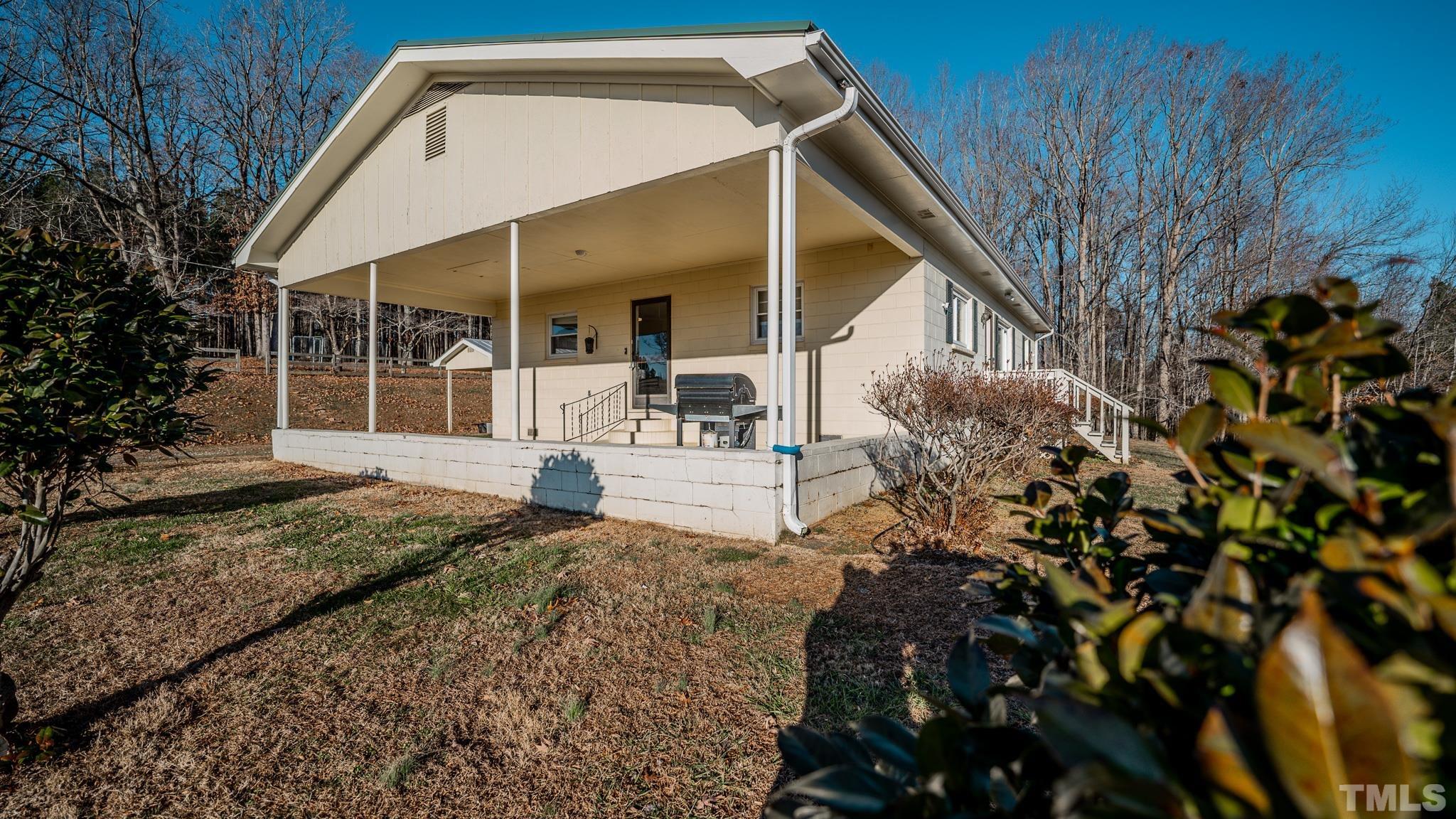 3772 Mt Harmony Church Road Rougemont, NC 27572 - Photo 59 of 66 a view of a house with a small yard and plants