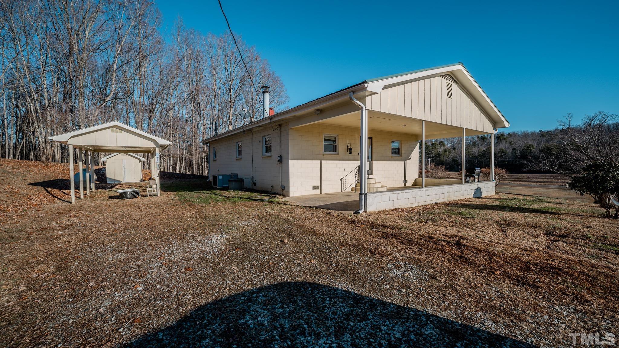 3772 Mt Harmony Church Road Rougemont, NC 27572 - Photo 61 of 66 a view of a house with backyard and chairs