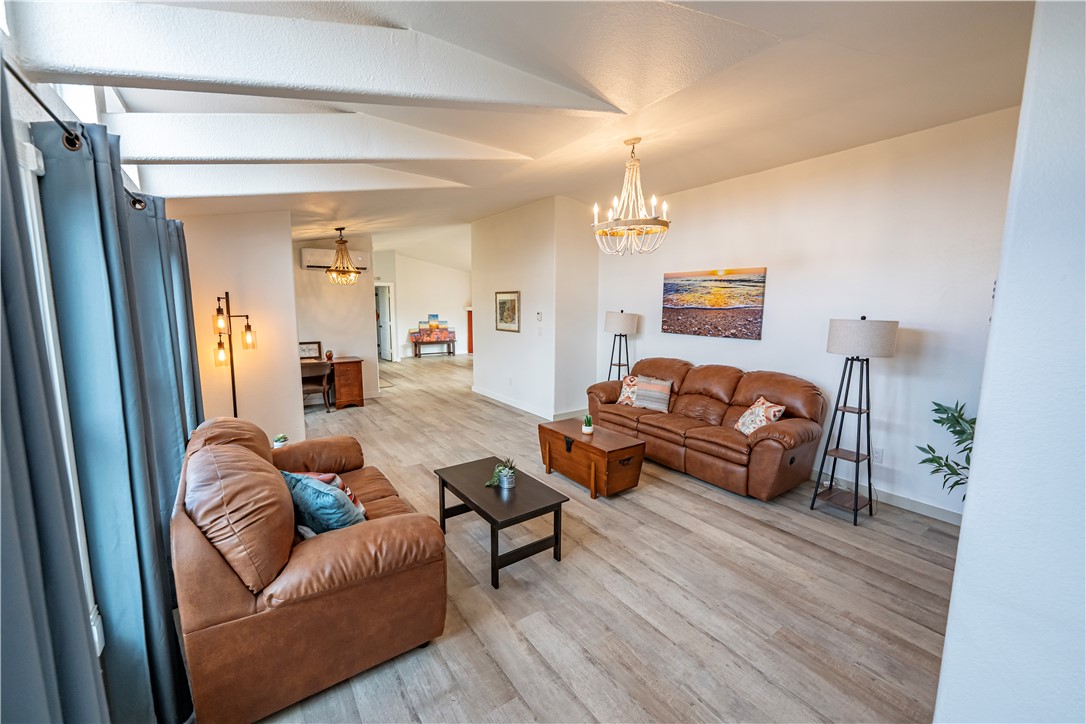 2765 North Silver Springs Road Kingman, AZ 86401 - Photo 48 of 60 a living room with furniture and a wooden floor
