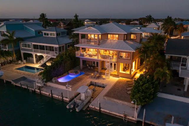 an aerial view of a house with swimming pool yard and outdoor seating
