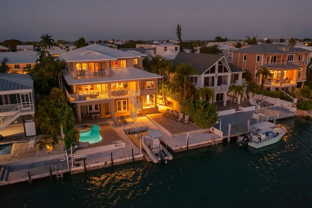 a living room with furniture and a ceiling fan