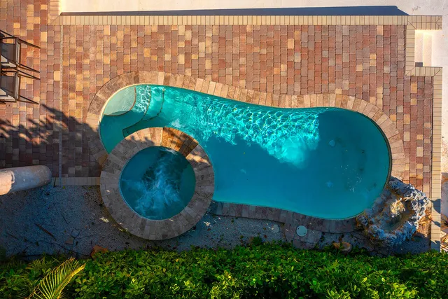 a view of workspace with wooden floor and windows