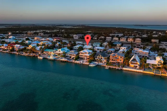 a view of a porch with wooden floor and fence