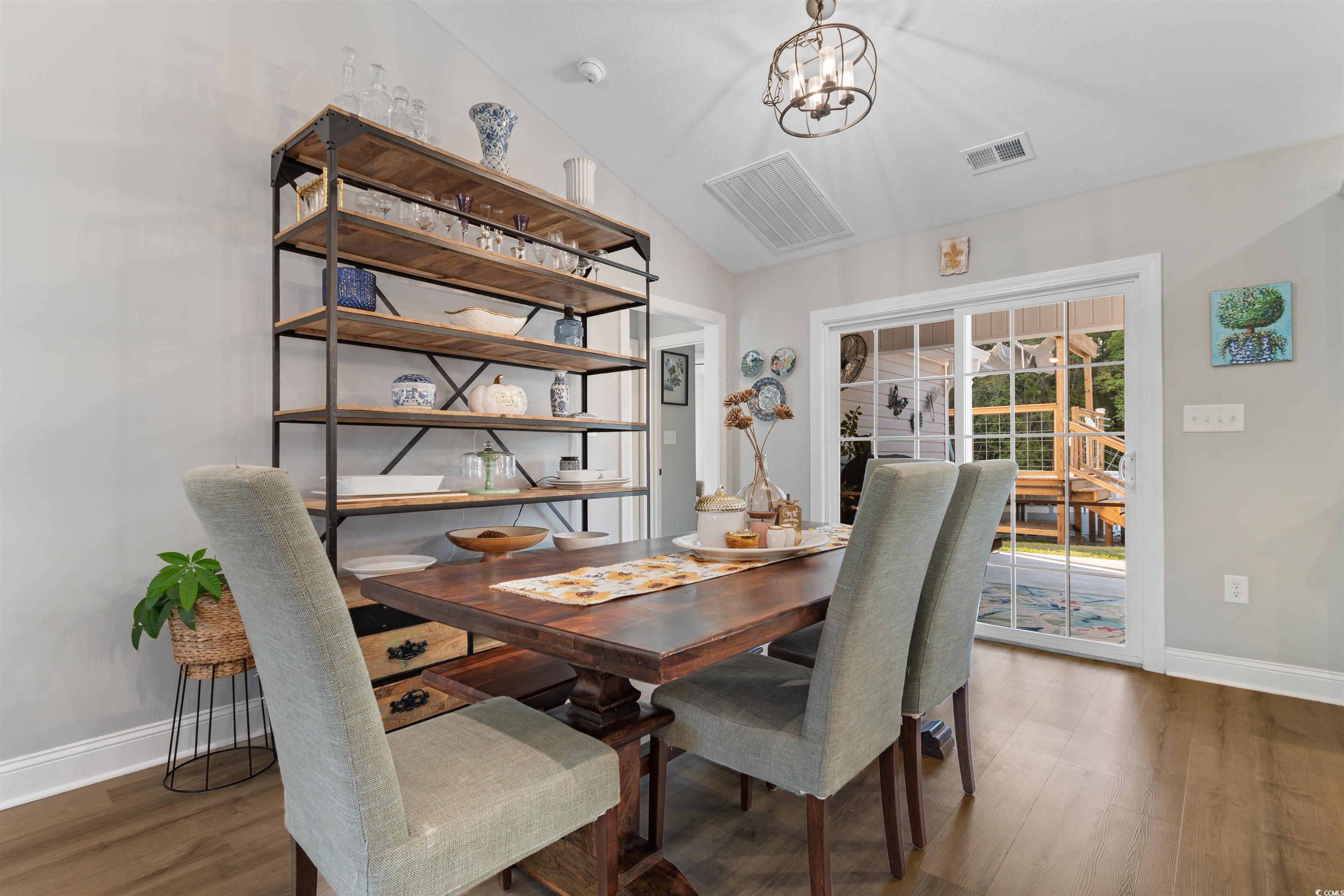 2279 Vaught Road Galivants Ferry, SC 29544 - Photo 12 of 40 Dining space with lofted ceiling, dark hardwood /