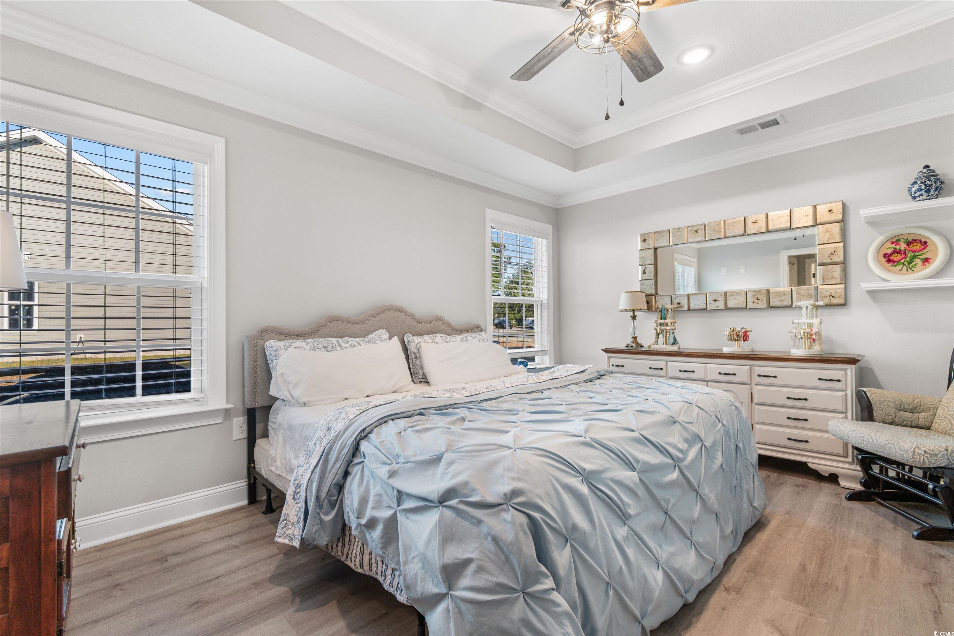 2279 Vaught Road Galivants Ferry, SC 29544 - Photo 16 of 40 Bedroom with ceiling fan, crown molding, a tray ce
