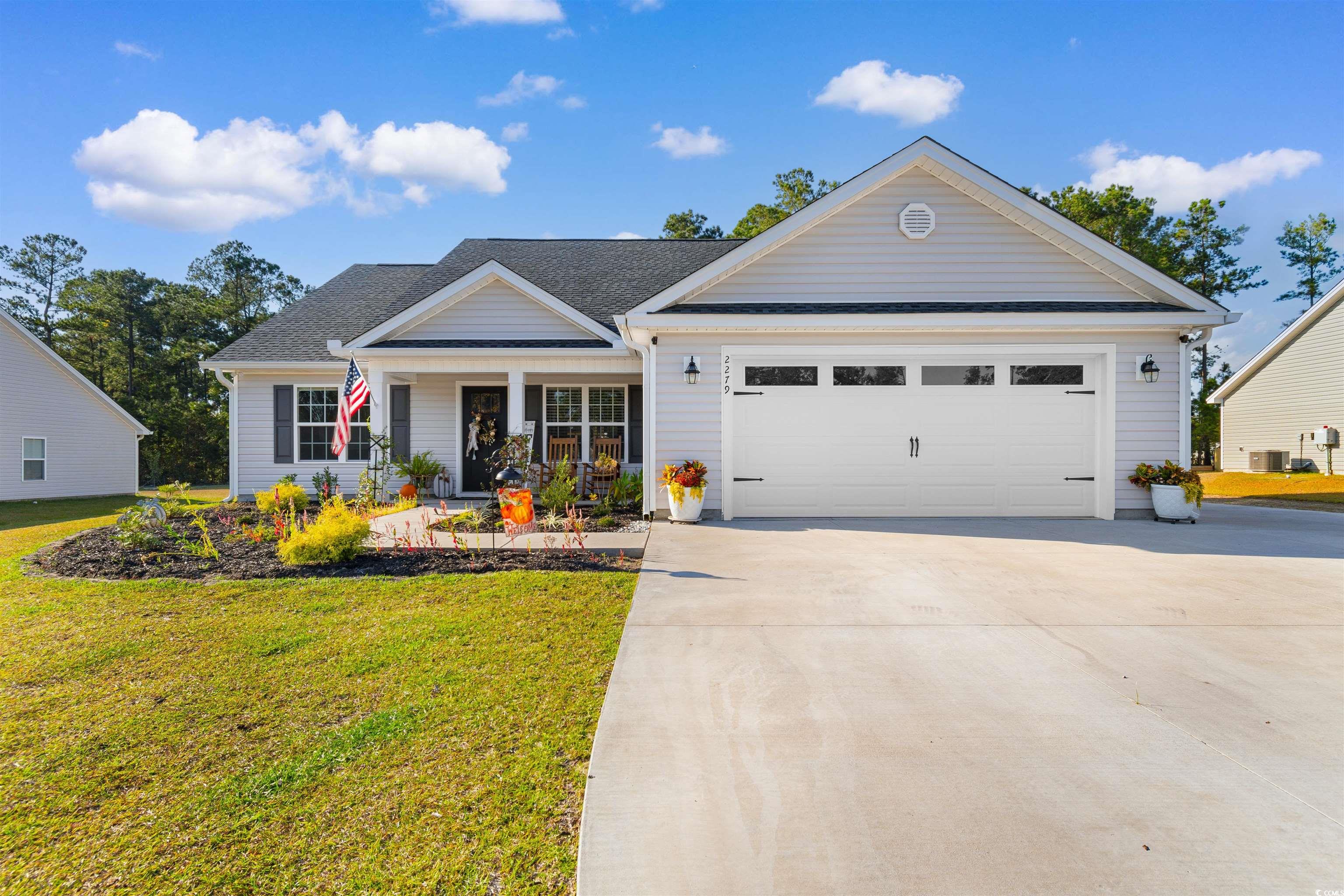 2279 Vaught Road Galivants Ferry, SC 29544 - Photo 40 of 40 View of front of property with a front yard, cooli