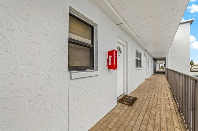 a bathroom with a granite countertop sink a toilet a shower and a mirror