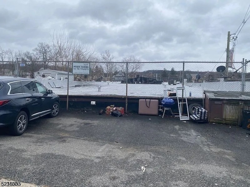 118 Main Street, Unit 1 Butler, NJ 07405 - Photo 12 of 12 a view of a garage and car parked