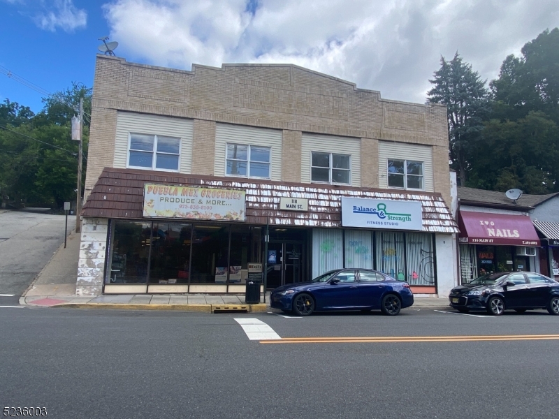 118 Main Street, Unit 1 Butler, NJ 07405 - Photo 2 of 12 a car parked in front of a building
