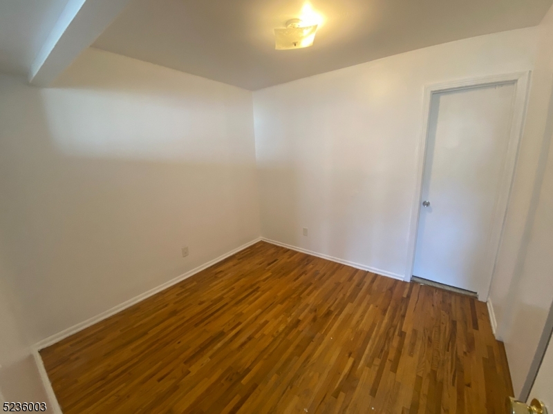 118 Main Street, Unit 1 Butler, NJ 07405 - Photo 5 of 12 a view of wooden floor in a room