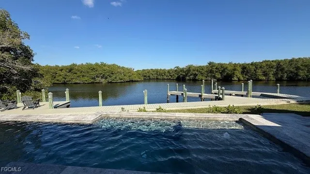 a view of roof deck with couches and sky view