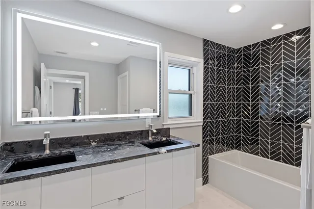 a kitchen with stainless steel appliances a refrigerator and a stove top oven