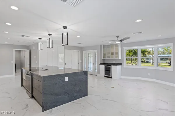 a close view of a sink and washing machine in a bathroom