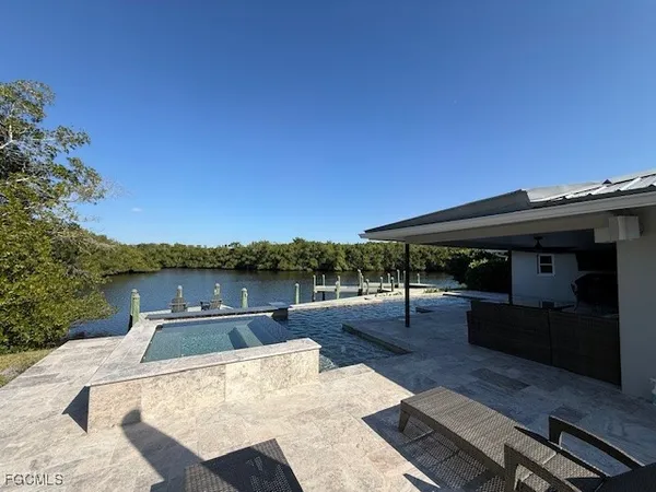 a view of a lake with outdoor seating