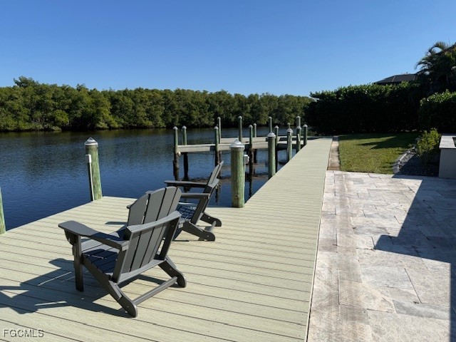 432 Seaworthy Road North Fort Myers, FL 33903 - Photo 4 of 7 a view of a lake with outdoor seating