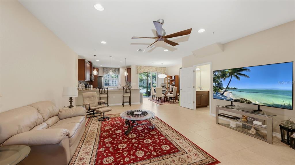 177 Navigation Circle Osprey, FL 34229 - Photo 11 of 43 a living room with furniture and a flat screen tv
