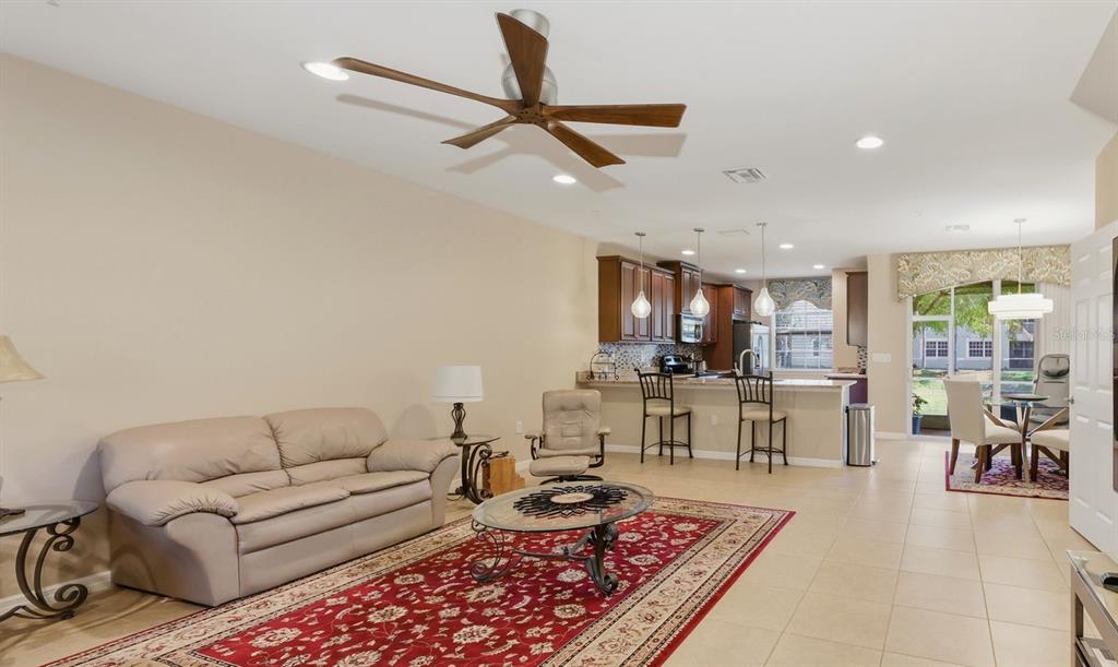 177 Navigation Circle Osprey, FL 34229 - Photo 12 of 43 a living room with furniture and a view of kitchen