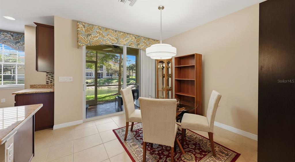 177 Navigation Circle Osprey, FL 34229 - Photo 14 of 43 a view of a dining room with furniture window and outside view
