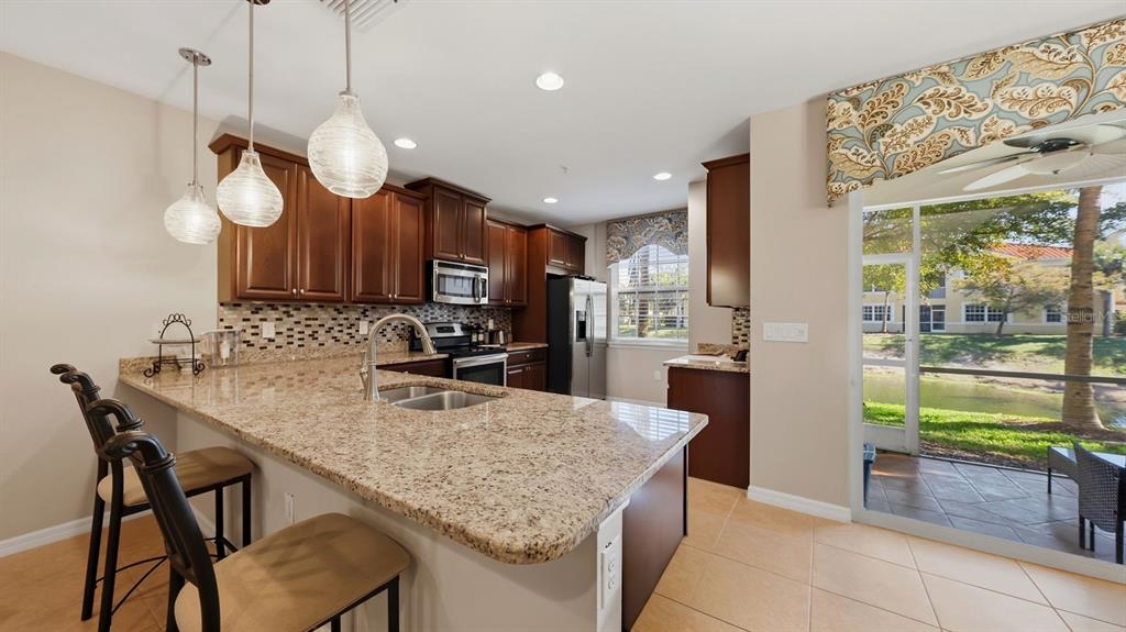 177 Navigation Circle Osprey, FL 34229 - Photo 15 of 43 a kitchen with a table and chairs in it