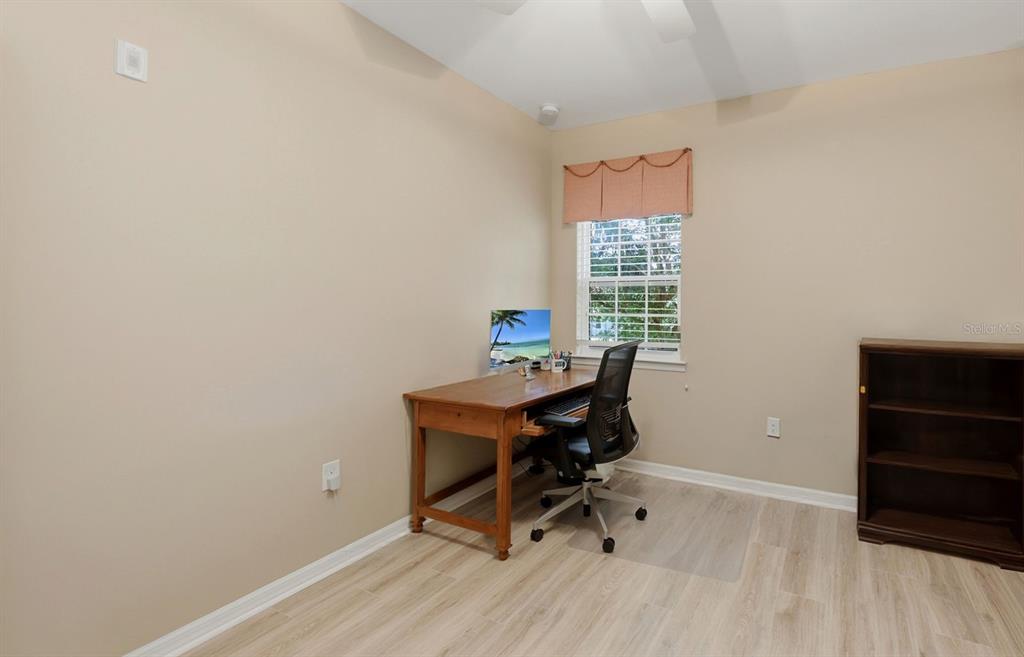177 Navigation Circle Osprey, FL 34229 - Photo 20 of 43 a workspace with furniture and wooden floor