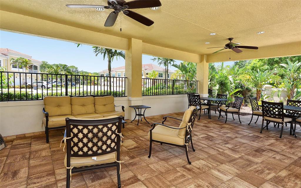 177 Navigation Circle Osprey, FL 34229 - Photo 39 of 43 a view of a porch with furniture and a yard