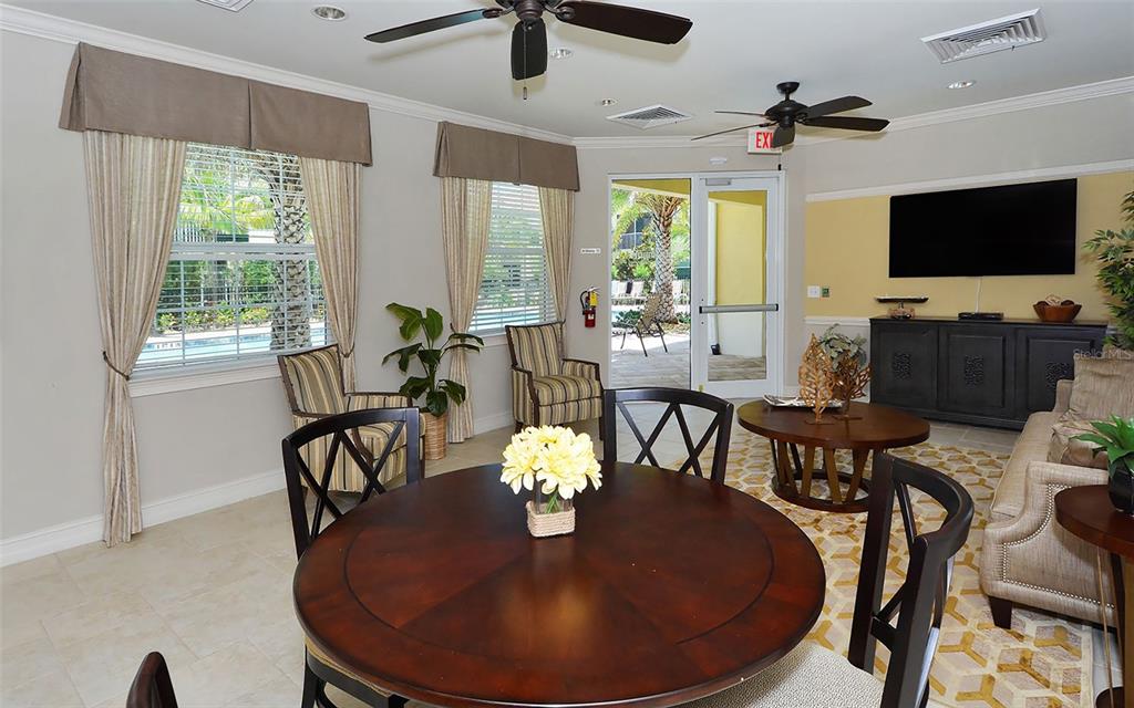 177 Navigation Circle Osprey, FL 34229 - Photo 43 of 43 a view of a dining room with furniture window and wooden floor