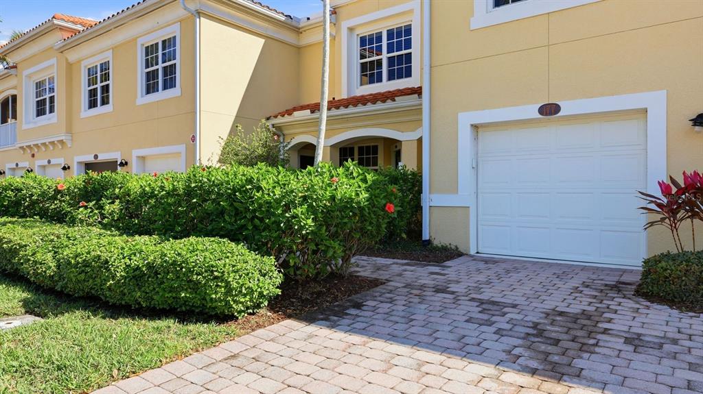 177 Navigation Circle Osprey, FL 34229 - Photo 8 of 43 a front view of a house with garden